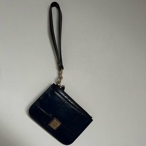 Navy Dooney and Bourke barely used wristlet. Included registration card.